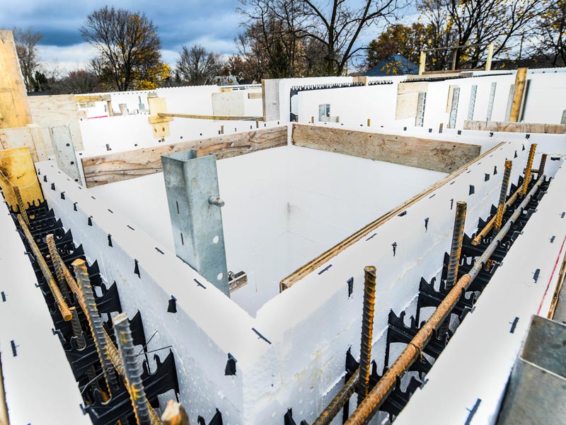 This photo shows a foundation being built with focus on Insulated Concrete Forms.