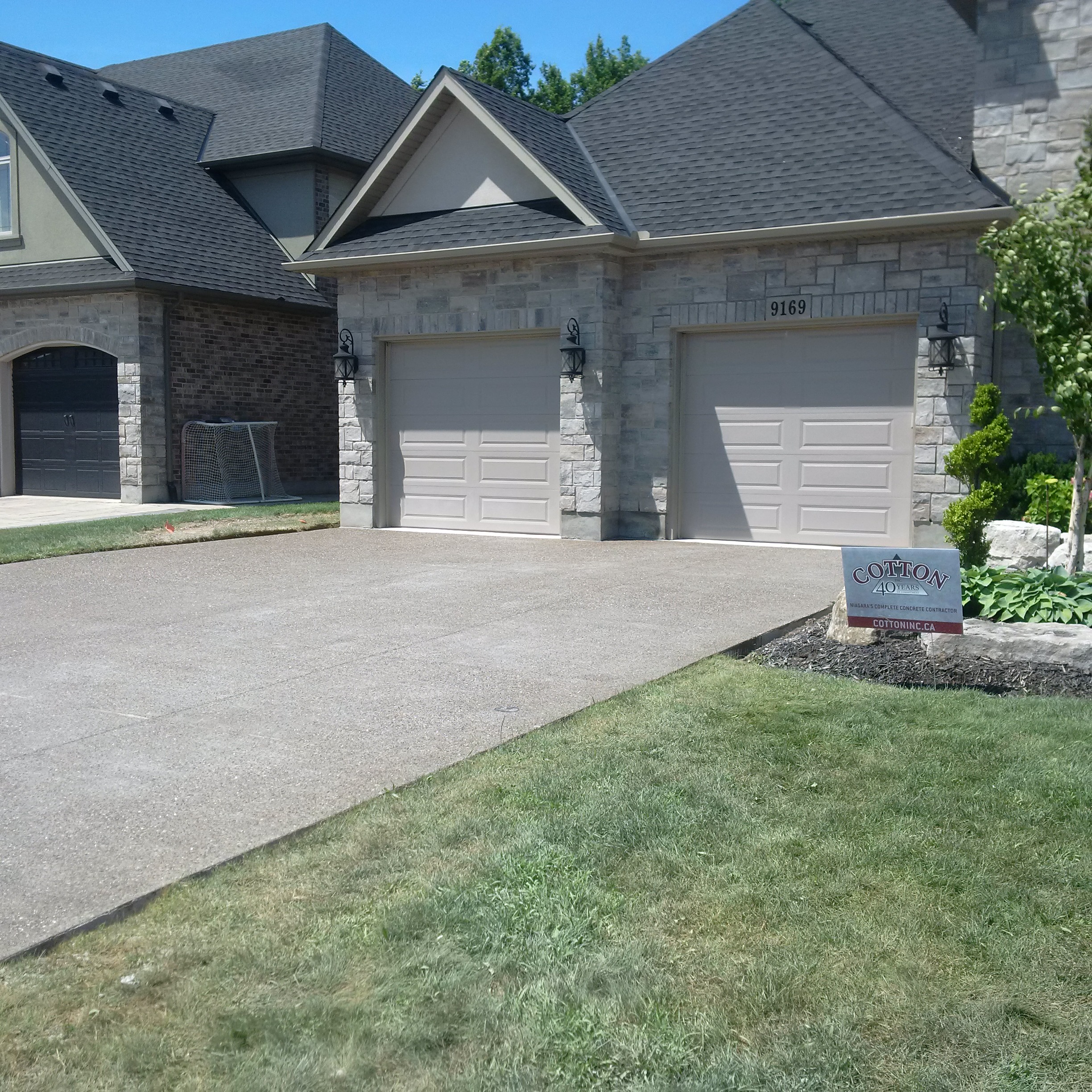 This photo shows a residential driveway and garage.